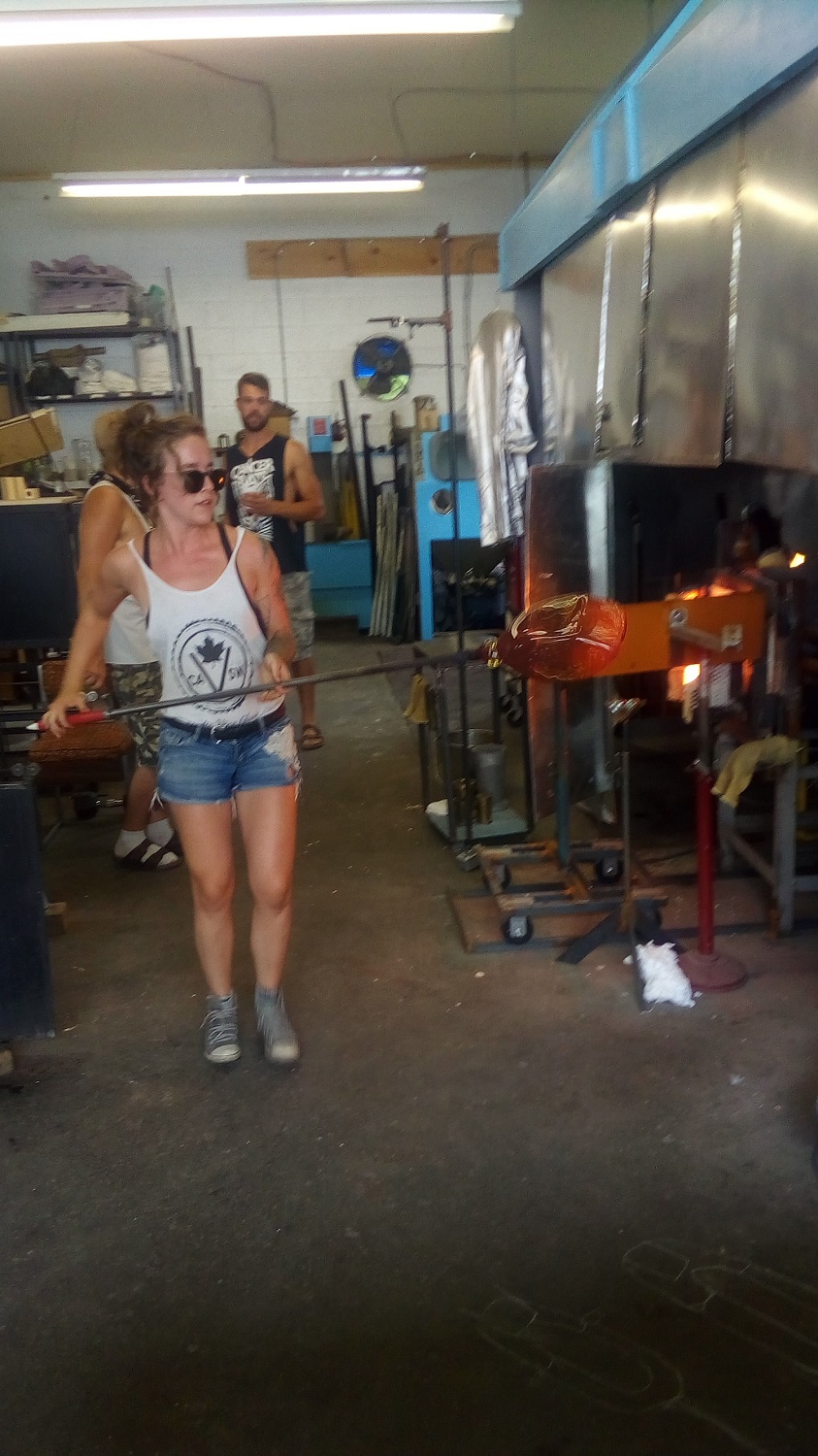 Working in a glass blowing studio.